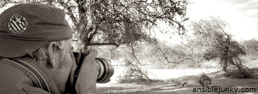 John photographing a lion at a safari in Marataba, South Africa